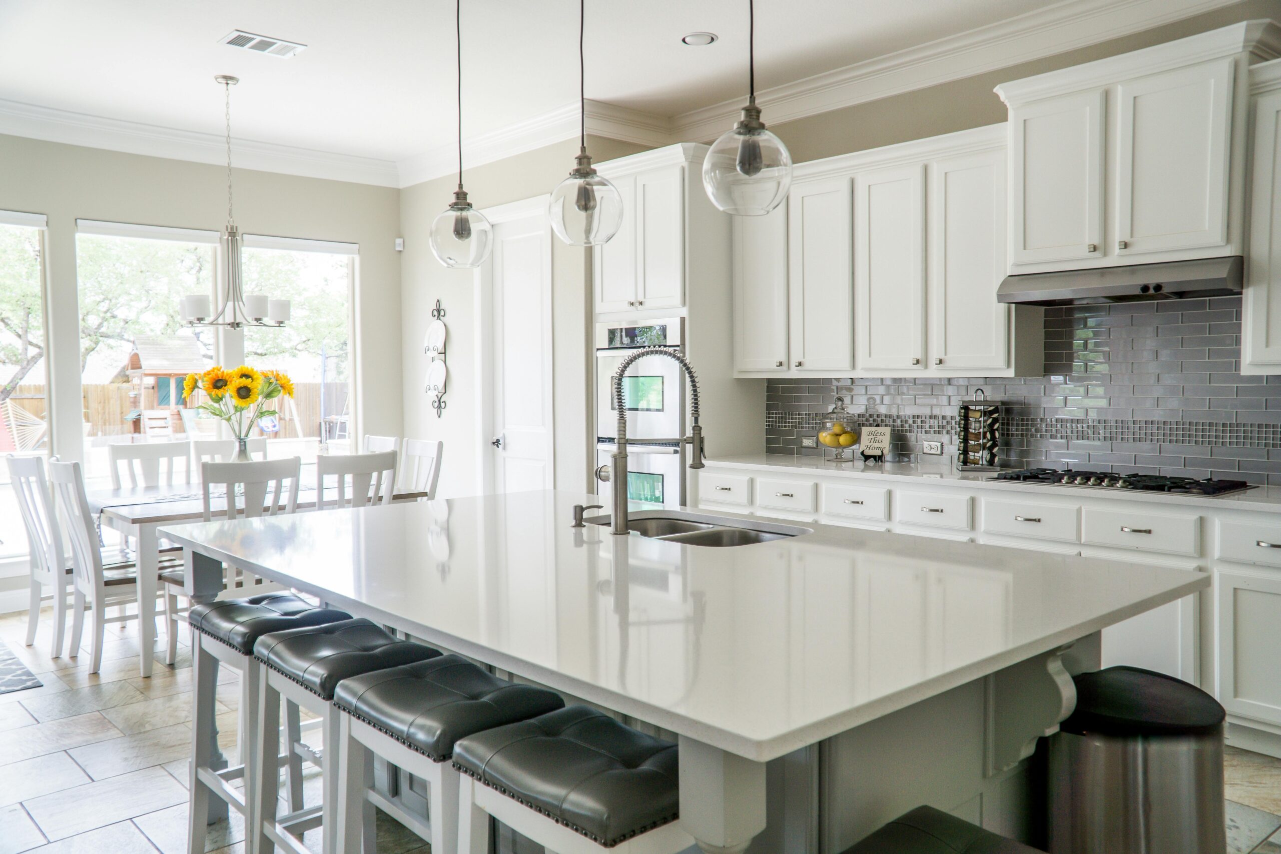 white kitchen with stainless steel appliances